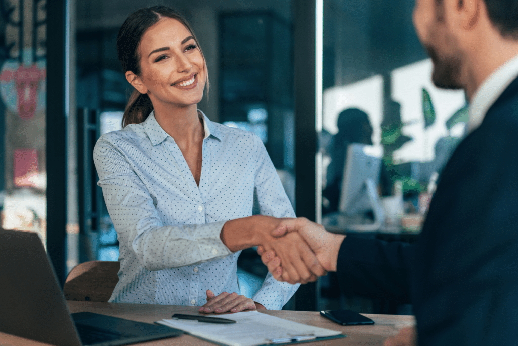 2 people shaking hands after an interview