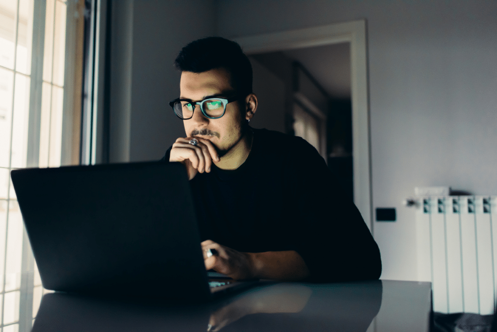 man using AI prompts on computer for his job search